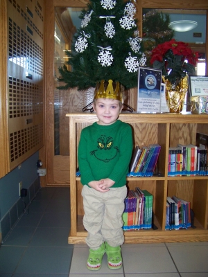 Theo Behn, age 3, has completed the 1,000 Books before Kindergarten early literacy program at the Reedsburg Public Library.  Theo proudly wears the crown he earned along with a literacy card game.  Reading to a child before Kindergarten creates a life long love of reading.  Stop by the Library to start this free program for any child that is not yet in school.