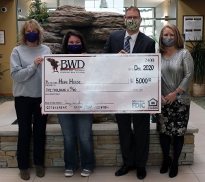 Bank of Wisconsin Dells gave $5,000 to Hope House of South Central Wisconsin in December. Seen here, from left, are Deb Bauer, Annabelle Lange, Scott Rockwell and Tammy Maki. The money went toward supporting families in need during the holidays. Due to the pandemic, Hope House received more requests than usual for aid. (Submitted photo)