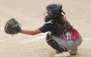 Catcher Alyssa Langes works as the catcher for the U-14 Reedsburg Red team in youth softball action vs. Baraboo last week at Nishan Park. (Photo by Troy Matz)