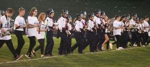 Members of the eighth grade band at Webb Middle School joined RAHS band members on the field for a pre-game show prior to Friday’s Homecoming football game at Millennium Field. (Photo by Troy Matz)