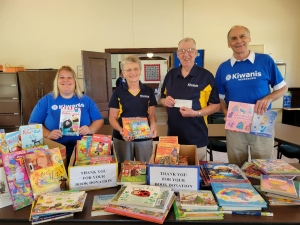 The Kiwanis Club of Reedsburg welcomed guests during a Business before Nine at the Reedsburg Area Chamber of Commerce last week. In two hours, club members collected 253 books to donate to local children. (Reedsburg Area Chamber of Commerce photo)